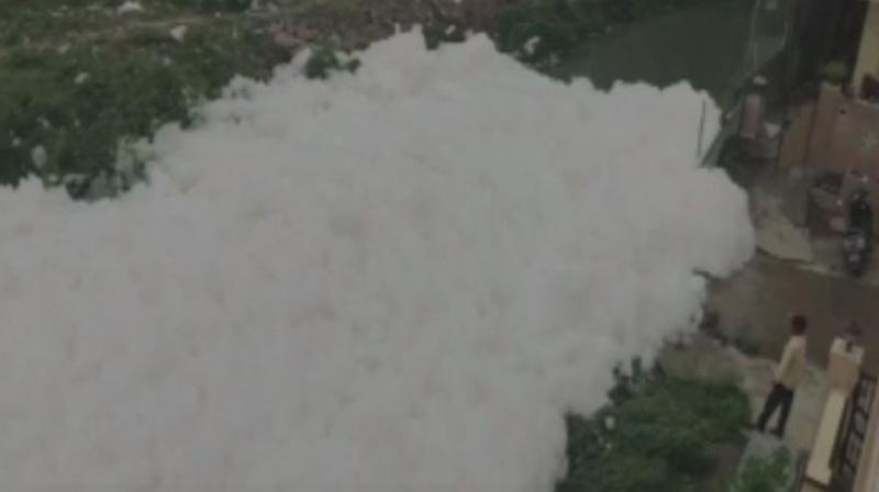 The reason behind the foam is the toxic wastes released into the drain and can be seen spilling on to the streets. (Photo: ANI | Twitter)
