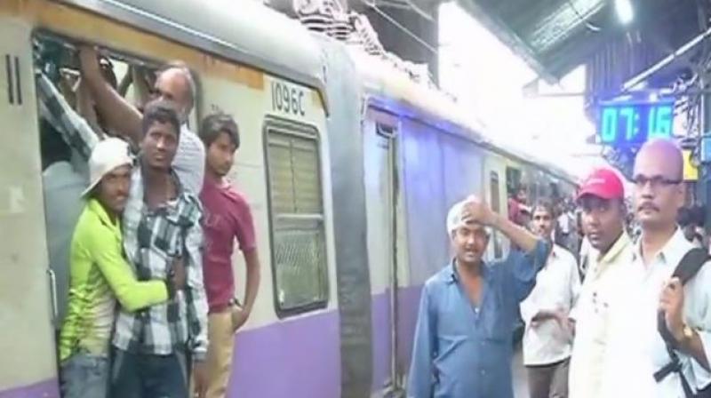 Mumbai locals back on track after rains left the city standstill. (Photo: ANI)