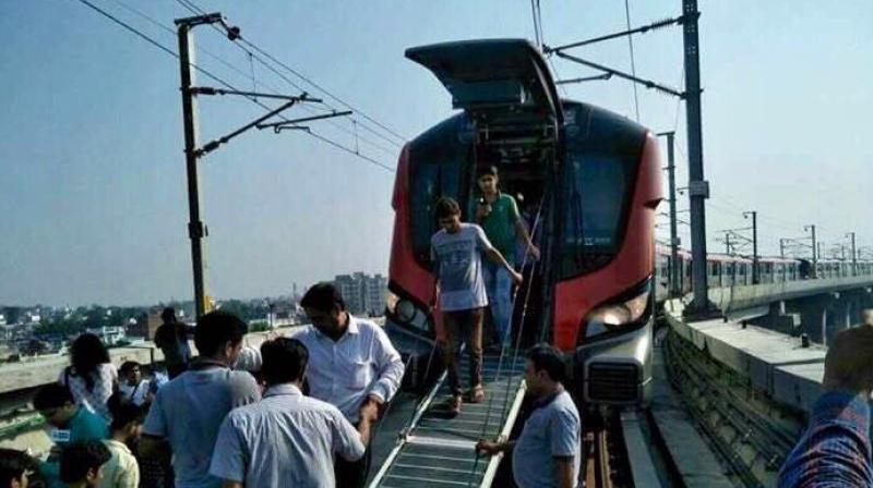 Stuck passengers, commuting in Lucknow Metro on its maiden commercial run, were taken out from the back through the emergency exit(Photo: Twitter | @yadavakhilesh)
