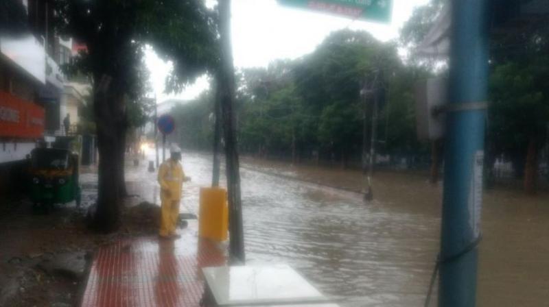 Roads were flooded in Madivala and HSR Layout, almost a repeat of July 2016 flooding. (Photo: ANI | Twitter)