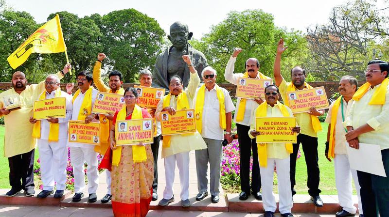 TD MPs stage a protest demanding special status for the state of Andhra Pradesh during the Budget session of Parliament in New Delhi on Tuesday. (Photo: PTI)
