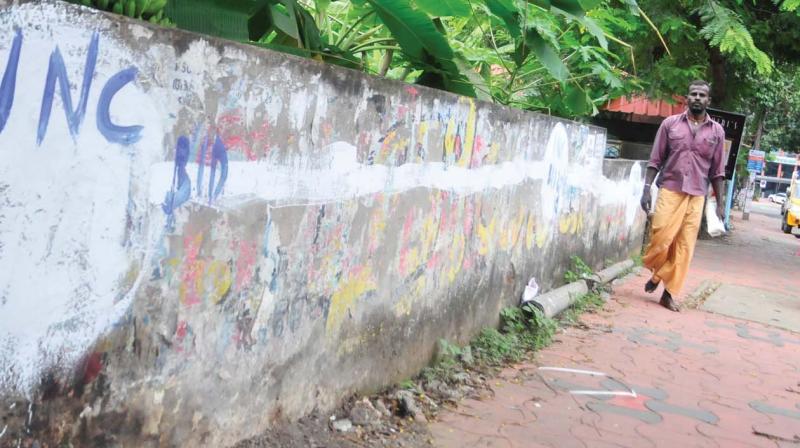 A graffiti on the wall at Pattom - Kaudiar road shows that it has been reserved by the Congress, on Saturday (Photo: DC)