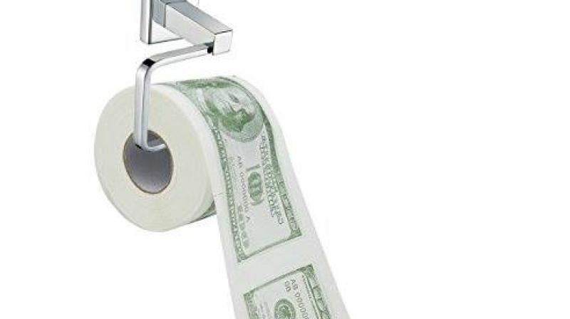 Geneva prosecutors are investigating after toilets in a bank and three restaurants were blocked by about $100,000. (Photo: Facebook/ Showbizlikes.com)