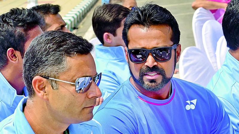 Indian coach Zeeshan Ali (left) and Leander Paes during the draw ceremony in Bengaluru on Thursday, eve of Indias Davis Cup tie against Uzbekistan.(Photo: Shahidhar B.)