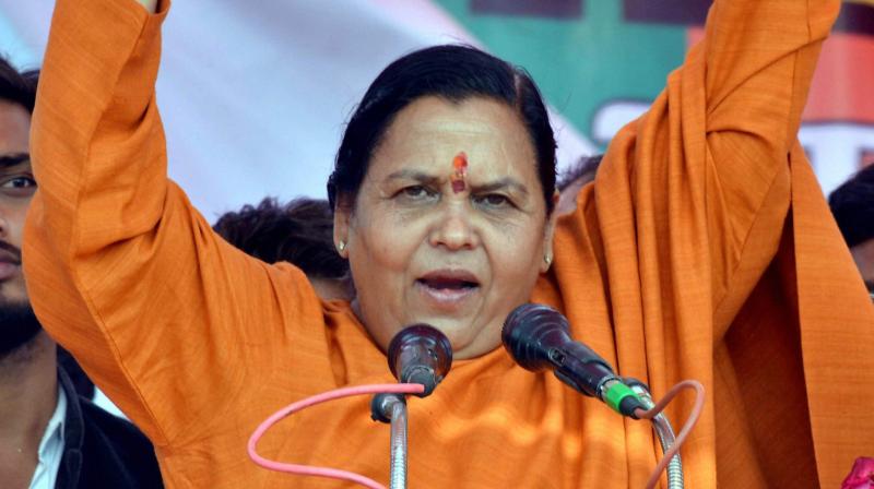 Union minister and BJP leader Uma Bharti addresses an election rally in Agra