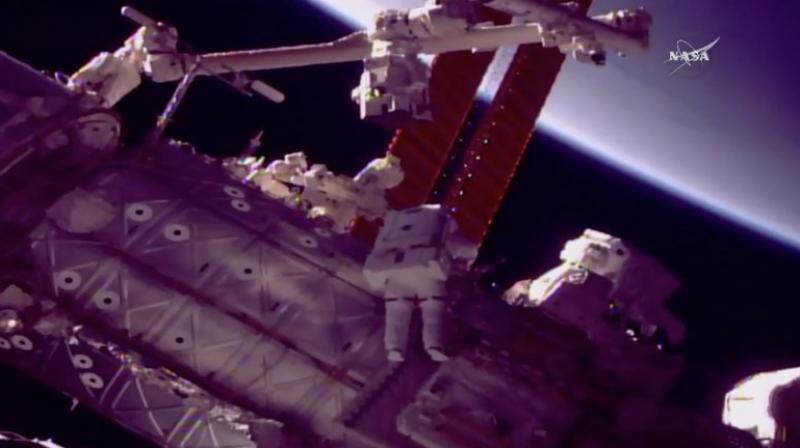 NASA astronauts changing the hand of the robotic arm on board the International Space Station (ISS). (Photo: NASA TV)