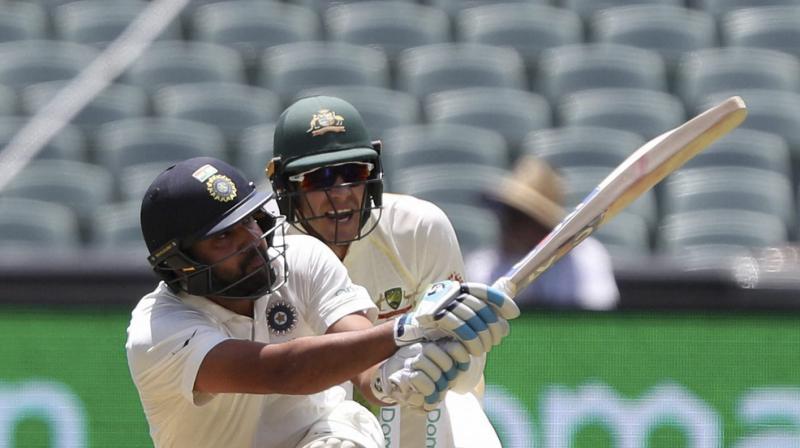 Paine was caught on the stump microphone telling team-mate Aaron Finch that he would join Mumbai Indians IPL team if the stylish Indian hits a six at the MCG, during the post-tea session of the third Tests second day. (Photo: AP)