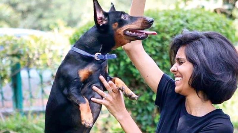 A file photograph of a dog lover with her mutt in town