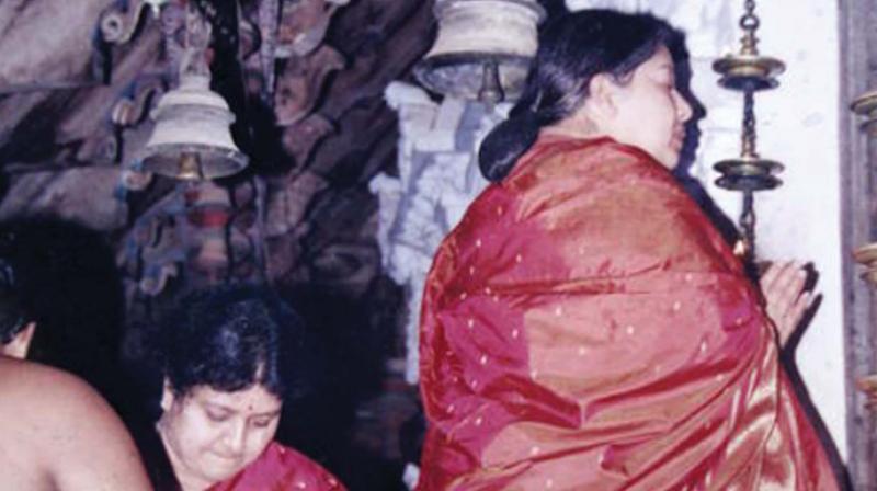 J. Jayalalithaa prays at Rajarajeshwara temple during her visit in 2001. Her close aide Sasikala is also seen.  (Photo Courtesy: TTK Devaswom)