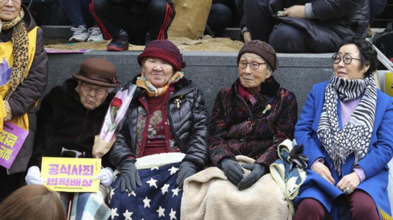 Former comfort women who were forced to serve for the Japanese troops as a sex slaves during World War II, attend a rally to mark the March First Independence Movement Day, the anniversary of the 1919 uprising against Japanese colonial rule, near the Japanese Embassy in Seoul, South Korea. (Photo: AP)
