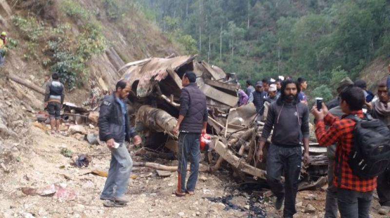 At least 24 people were killed when an overcrowded bus skidded off the road and crashed in remote western Nepal, local officials said. (Photo: AFP)