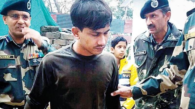 Chandu Chauhan being received by BSF personnel at the Attari border. (Photo: PTI)