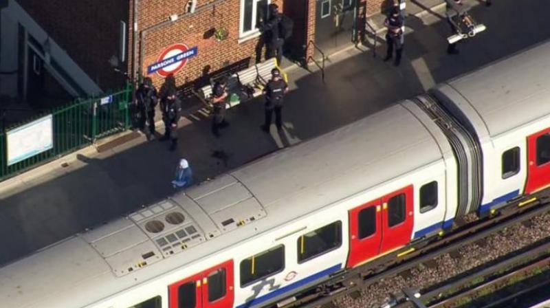 In this aerial image made from video, police officers work at the Parsons Green Underground station after an explosion in London on Friday. (Photo: AP)