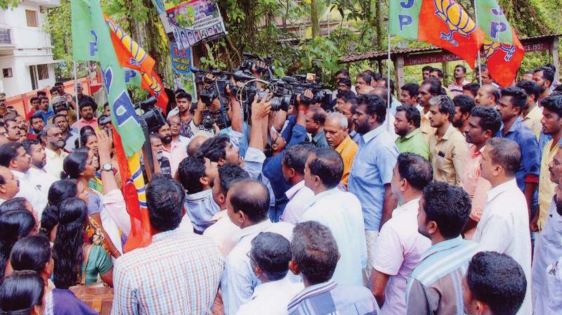 BJP activists gathered to sing national anthem in front of Kerala State Chalachitra Academy director  Kamals house. 	FILE