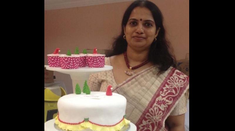 Padma Renjith with a cake.