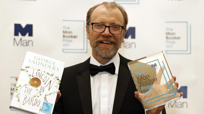 Author George Saunders of the United States with his book Lincoln in the Bardo during a photocall after being announced winner of the 2017 Man Booker Prize, in London. (Photo: AP)