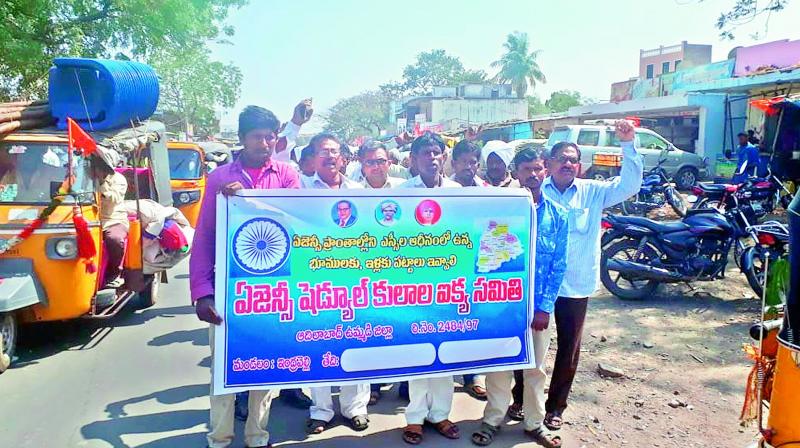 Dalits living in Agency areas take out a rally under the banner of the Agency Scheduled Kulala Ikya Samiti demanding pattas for the lands they have been cultivating in Indravelli Town on Monday. (Photo:DC)