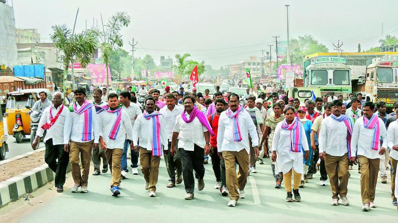 Thammineni Veerabadram and Julakanti Rangareddy participate in Mahajana Padayatra in Adilabad town on Wednesday. 	(Photo: DECCAN CHRONICLE)