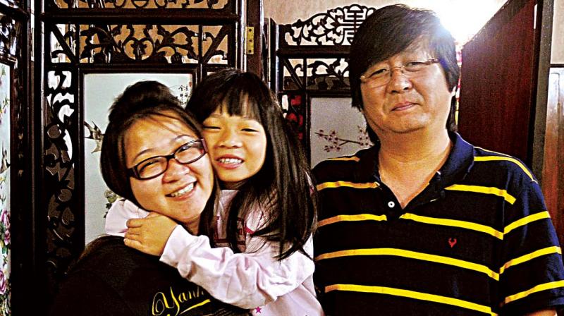 Jason Chiu and his family at their house in Bengaluru