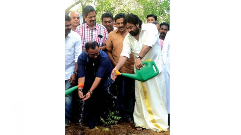 Actor Mohanlal plants a sapling along with film maker Lal Jose at Thumba St Xaviers College in Thiruvananthapuram on World Environment Day on Monday. (Photo: Peethambaran Payyeri)