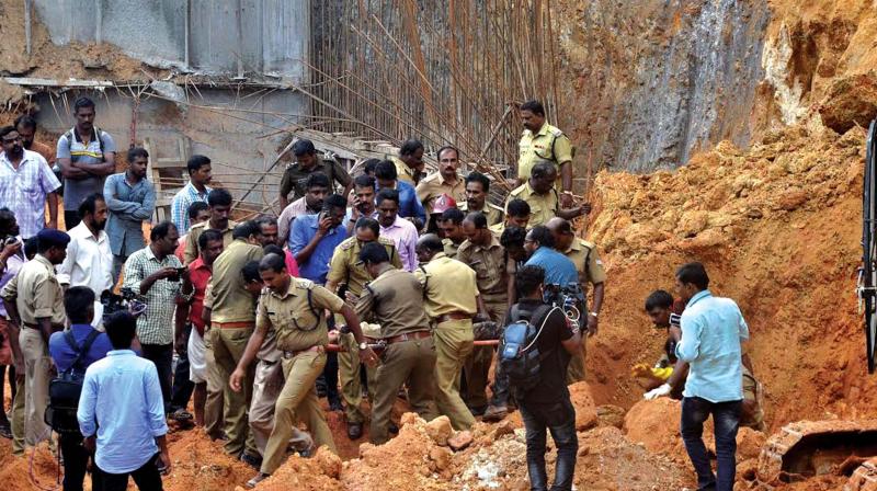 Fire and rescue team recovers a body of a migrant labourer from the work site in Pangappara where a landslide claimed four lives on Monday.	 (Photo: DC)