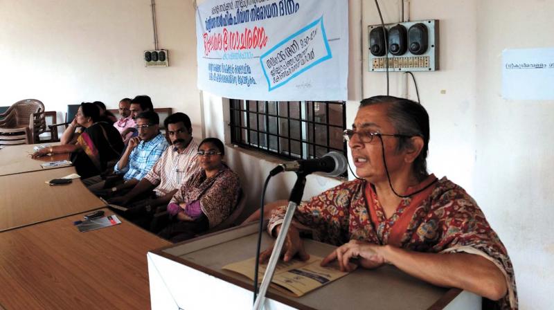Activist K. Ajitha speaks at the open forum held at district panchayat conference hall in Kozhikode on Saturday.