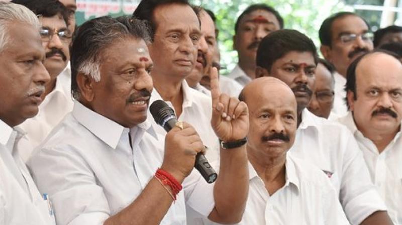 Former Tamil Nadu Chief Minister O Panneerselvam gestures during a press conference at his Greenways Road residence in Chennai on Thursday. (Photo: PTI)