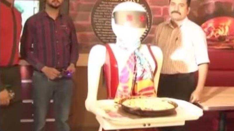 Pizza.com, located in the city of Multan in the Punjab province, is seeing unusual rush of customers after the local media reported about the robot serving food. (Photo: Videograb)