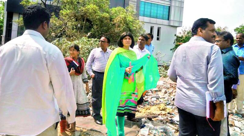 GHMC Commissioner Dr B Janardhan Reddy and central zone commissioner Ms Hari Chandana Dasari inspecting the two-acre open space at Jubilee Hills road number 36 on Wednesday.  (Photo: DC)