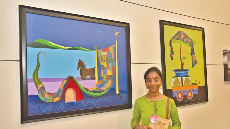 Nayana Melinamani with her artwork from Gulbarga (Runners Up in Painting Category from Gulbarga) last year.