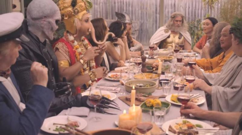 Other divinities shown in the ad included Jesus, Buddha, Thor and Zeus, sitting around a dining table tucking into lamb at a barbecue. (Photo: YouTube screengrab)