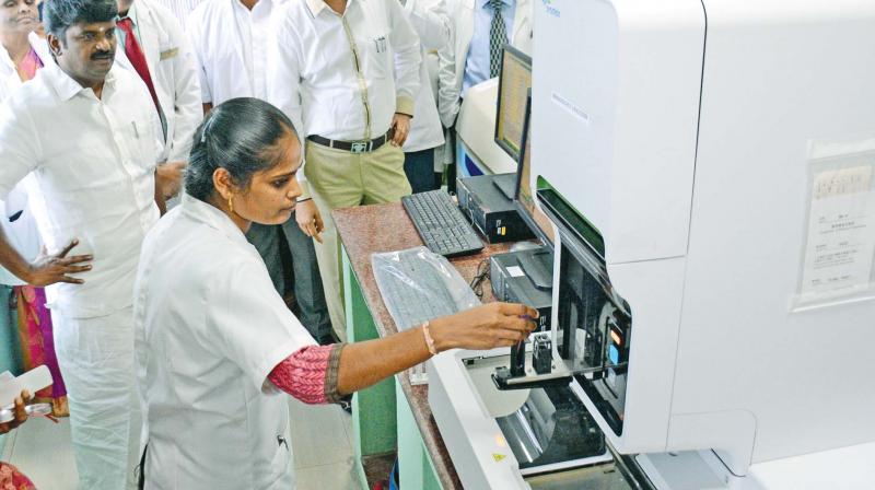 Health Minister C. Vijayabaskar takes a look at the new equipment in hematology laboratory at Tamil Nadu Government Dental College and Hospital after its inauguration on Tuesday. (Photo: DC)