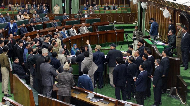 Opposotion members shout slogans in the well of the Jammu and Kashmir Assembly. (Photo: PTI)