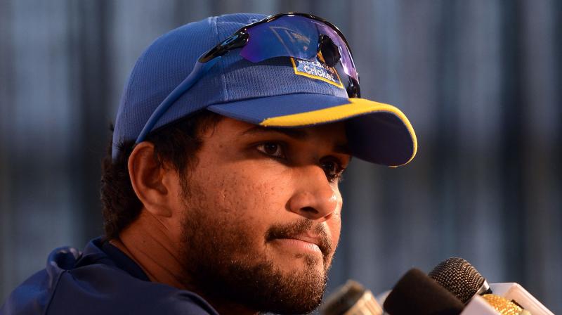 Chandimal pleaded not guilty to the charge, before attending the hearing where match referee Javagal Srinath, after utilising the time available to him under the code to make his decision, handed Chandimal the maximum punishment, which was two suspension points and a fine of 100 percent of his match fee. (Photo: AFP)