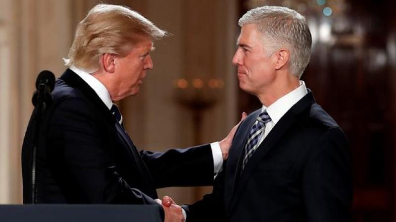 President Donald Trump shakes hands with 10th US Circuit Court of Appeals Judge Neil Gorsuch, his choice for Supreme Court Justices in the East Room of the White House. (Photo: AP)