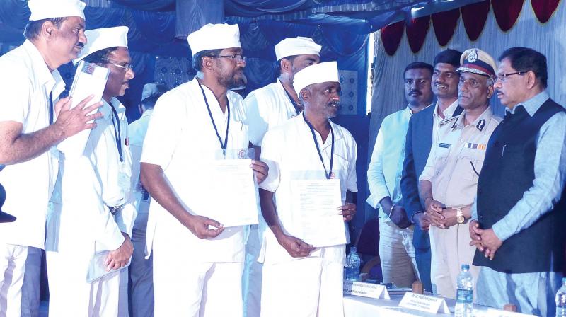 State Home Minister Dr. G Parameshwar and Karnataka DG (Prisons) H.N.Satyanarayan Rao during a function to hand over the release documents to prisoners, at Parappana Agrahara Prisons in Bengaluru on Thursday. (Photo: R. Samuel)