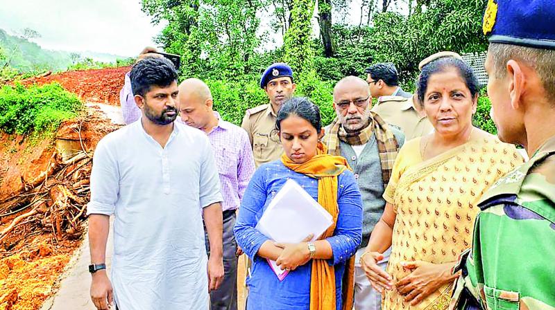 Defence minister Nirmala Sitharaman reviews the situations in flood-affected areas, in Kodagu on Friday. (Photo: PTI)