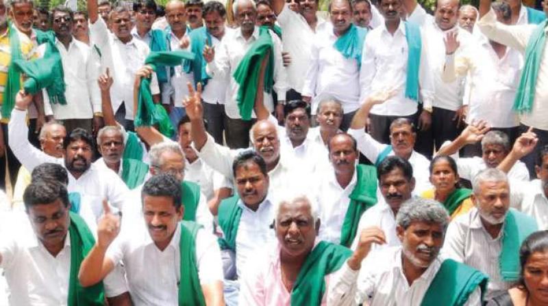 A file photo of farmers protesting demanding waiver of farmer loans.