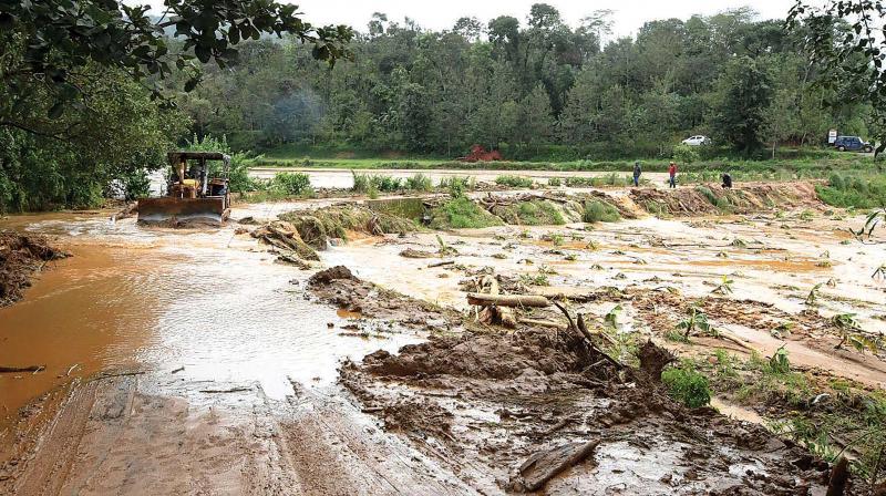 A road in the flood-hit Madapur village of Kodagu district.