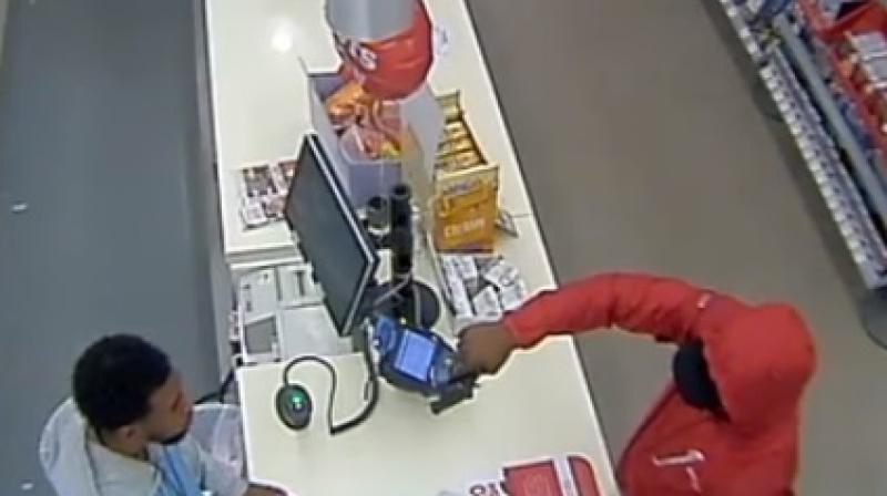 Video captured gunman trying to rob a store spooked by cashiers deadly stare. (Photo: Youtube screengrab)