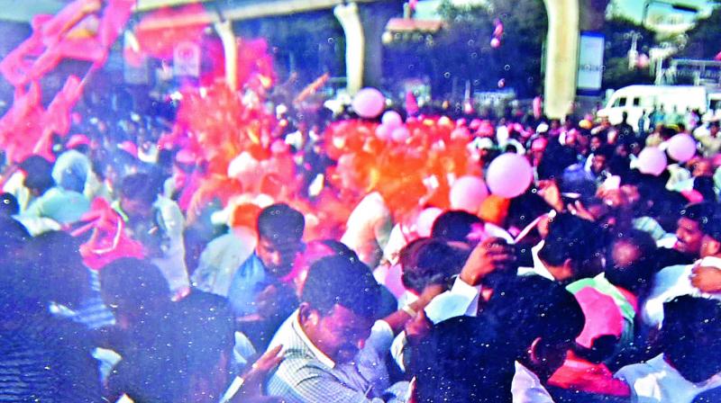 Hydrogen balloons carried by the TRS workers explode minutes before caretaker  minister K.T. Rama Raos road show was scheduled to start near Uppal metro station where hundreds of TRS party supporters have gathered.