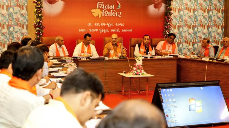 During the partys brainstorming session, BJP chief Amit Shah asked the party leaders to make people aware of the good work done by the governments led by Narendra Modi at the Centre and Chief Minister Vijay Rupani in Gujarat, party sources said. (Photo: Twitter/@AmitShah)