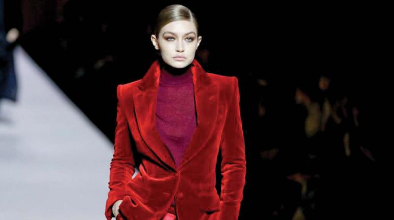 Gigi Hadid in a beautiful Burgandy Velvet Pant suit from Tom Fords collection
