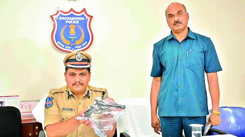 Police display the gun used by the accused.