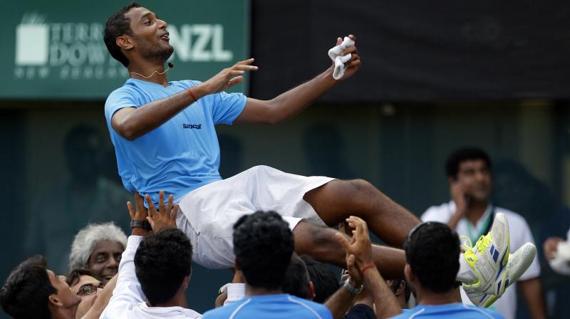 Ramkumar Ramanathan is lifted by teammates in celebration after his victory against New Zealands Finn Tearney. (Photo: PTI)