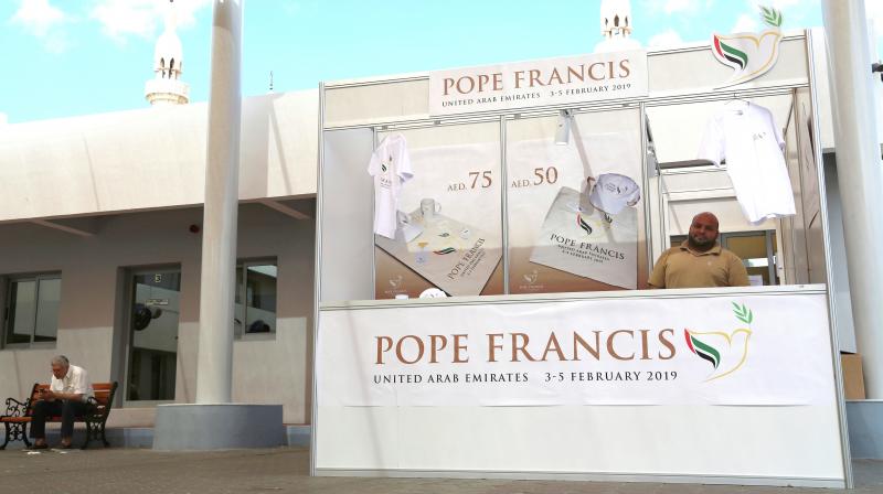 A man sells memorabilia for Pope Francis upcoming trip to the United Arab Emirates at St. Marys Catholic Church in Dubai. (Photo: AP)