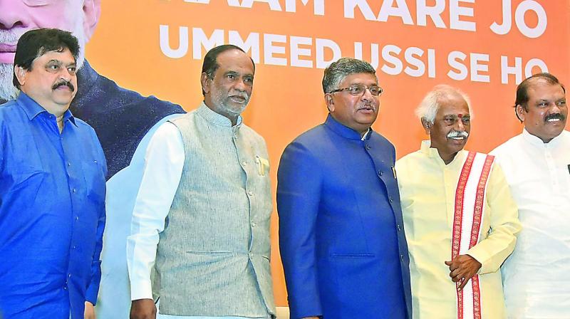 Union minister for IT and Law Ravi Shankar Prasad (center) along with BJP MP Bandaru Dattatraya and BJP state president Dr. K. Laxman in Hyderabad.(Photo:  Pavan)