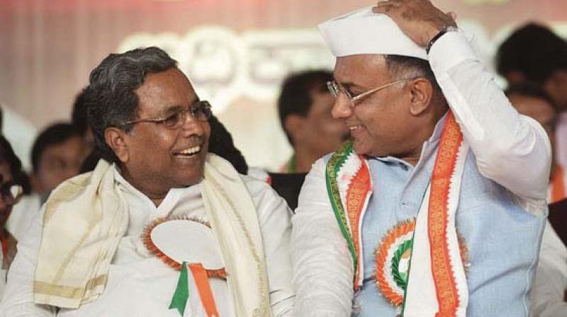 KPCC president Dinesh Gundurao with former chief minister Siddaramaiah in this file photo.
