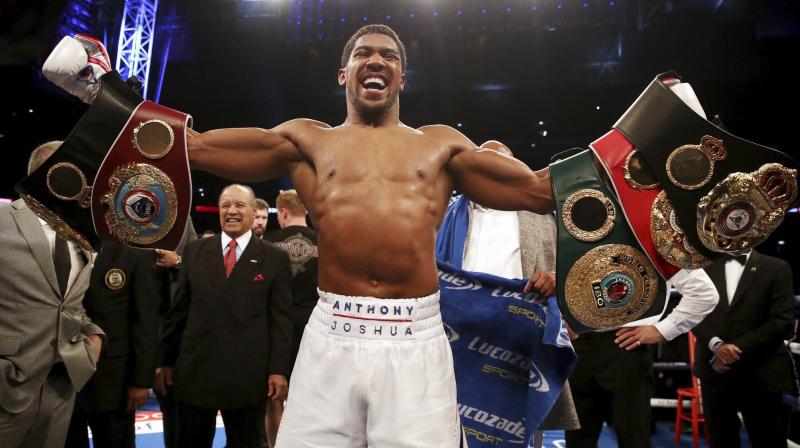 Victory saw Joshua extend his unbeaten professional record to 22 wins from 22 fights, with 21 knockouts, in front of a raucous home crowd. (Photo: AP)