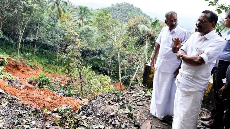 Minister TP Ramakrishnan examining the spot where the reconstruction of the Ghat Road is on at Chippilithode Adivaram, Kozhikode on Friday. 	 DC